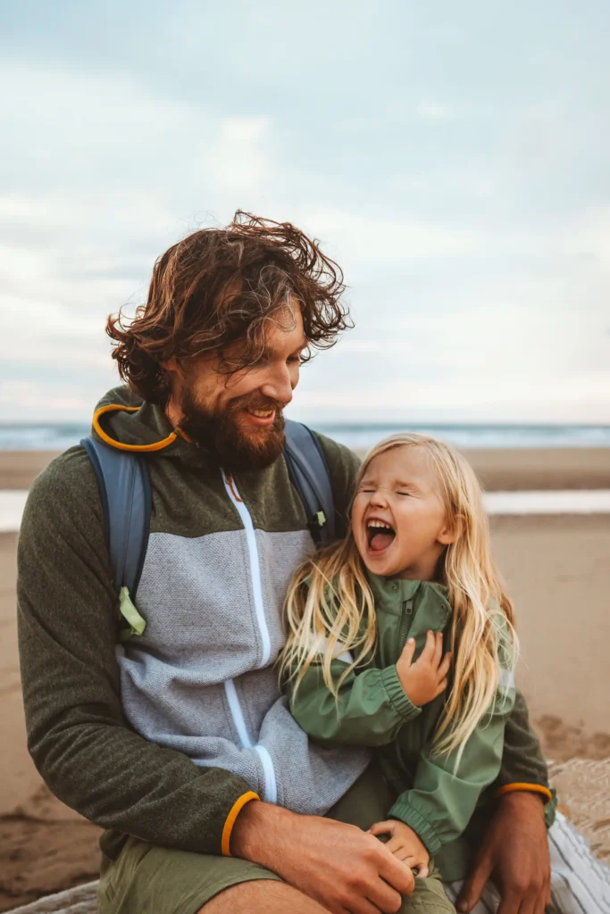 Father with child on a beach